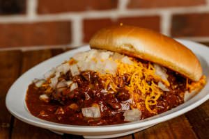 One (1/2 lb.) patty served with chili, cheddar cheese, and onions. Your choice of condiments.