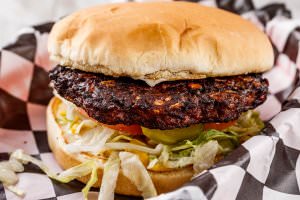Chipotle Black Bean patty (vegetarian option), bottomed with lettuce, tomatoes, onions, and pickles. Your choice of condiments.
