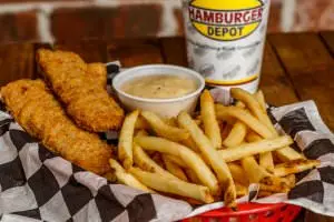 (3) Steak fingers served with cream gravy and fries.