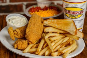 (3) Fried fish filets served with fries, tartar sauce, Hush Puppies, and a dinner salad.