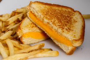 (2) Slices of american cheese on Texas toast, served with fries.