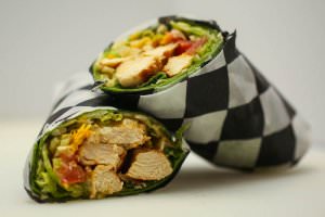(6 oz.) Marinated chicken breast rolled with lettuce, tomatoes, and grated cheddar cheese. Your choice of tortilla and dressing.