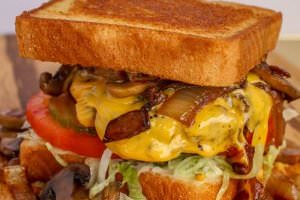One (1/2 lb.) patty served with grilled onions, mushrooms, and (2) slices of american cheese, bottomed with lettuce, tomatoes, and pickles. Your choice of condiments.