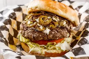 One (1/2 lb.) patty served with cream cheese and grilled jalapeños, bottomed with lettuce, tomatoes, onions, and pickles. Your choice of condiments.